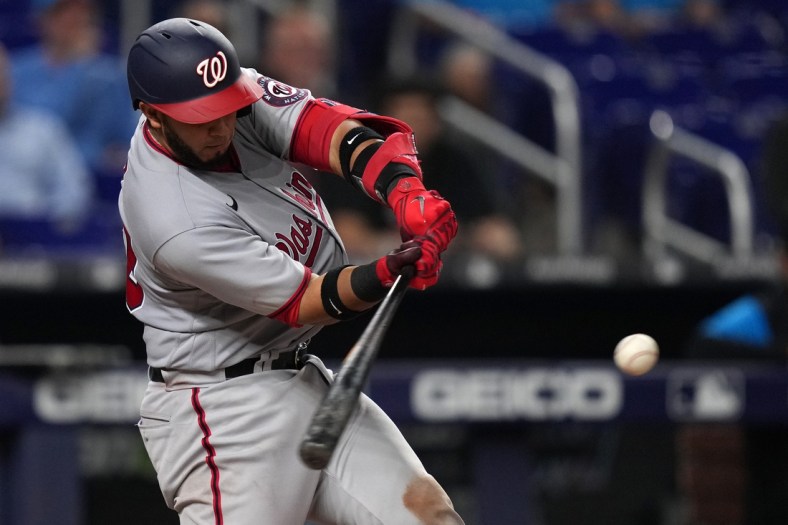 May 18, 2022; Miami, Florida, USA; Washington Nationals catcher Keibert Ruiz (20) singles in the go ahead and eventual game winning run in the tenth inning against the Miami Marlins at loanDepot park. Mandatory Credit: Jasen Vinlove-USA TODAY Sports