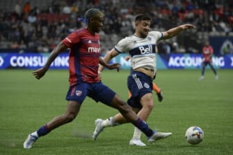 May 18, 2022; Vancouver, British Columbia, CAN;  Vancouver Whitecaps forward Lucas Cavallini (9) reaches for the ball against FC Dallas defender Nkosi Tafari (17) during the first half at BC Place. Mandatory Credit: Anne-Marie Sorvin-USA TODAY Sports