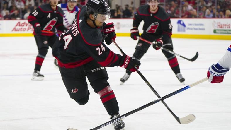 May 18, 2022; Raleigh, North Carolina, USA; Carolina Hurricanes center Seth Jarvis (24) takes a shot against the New York Rangers during the first period in game one of the second round of the 2022 Stanley Cup Playoffs at PNC Arena. Mandatory Credit: James Guillory-USA TODAY Sports