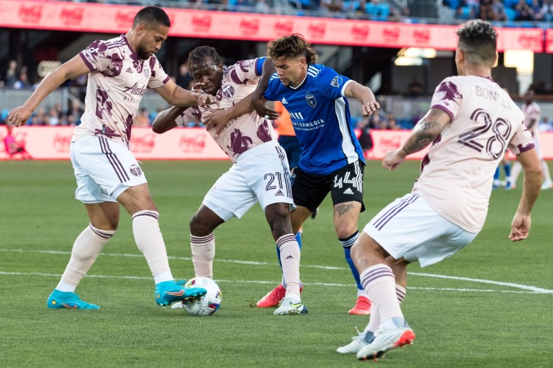 May 18, 2022; San Jose, California, USA; Portland Timbers midfielder Diego Char   (21) and San Jose Earthquakes forward Cade Cowell (44) battle for possession during the first half at PayPal Park. Mandatory Credit: John Hefti-USA TODAY Sports