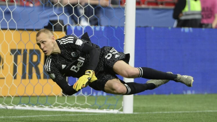 May 18, 2022; Vancouver, British Columbia, CAN;  Vancouver Whitecaps goaltender Cody Cropper (55) dives for the ball against the FC Dallas during the second half at BC Place. Mandatory Credit: Anne-Marie Sorvin-USA TODAY Sports
