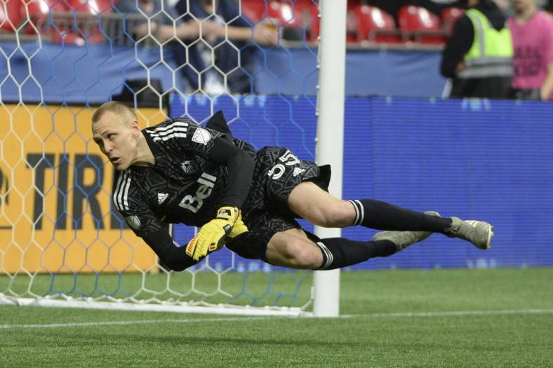 May 18, 2022; Vancouver, British Columbia, CAN;  Vancouver Whitecaps goaltender Cody Cropper (55) dives for the ball against the FC Dallas during the second half at BC Place. Mandatory Credit: Anne-Marie Sorvin-USA TODAY Sports