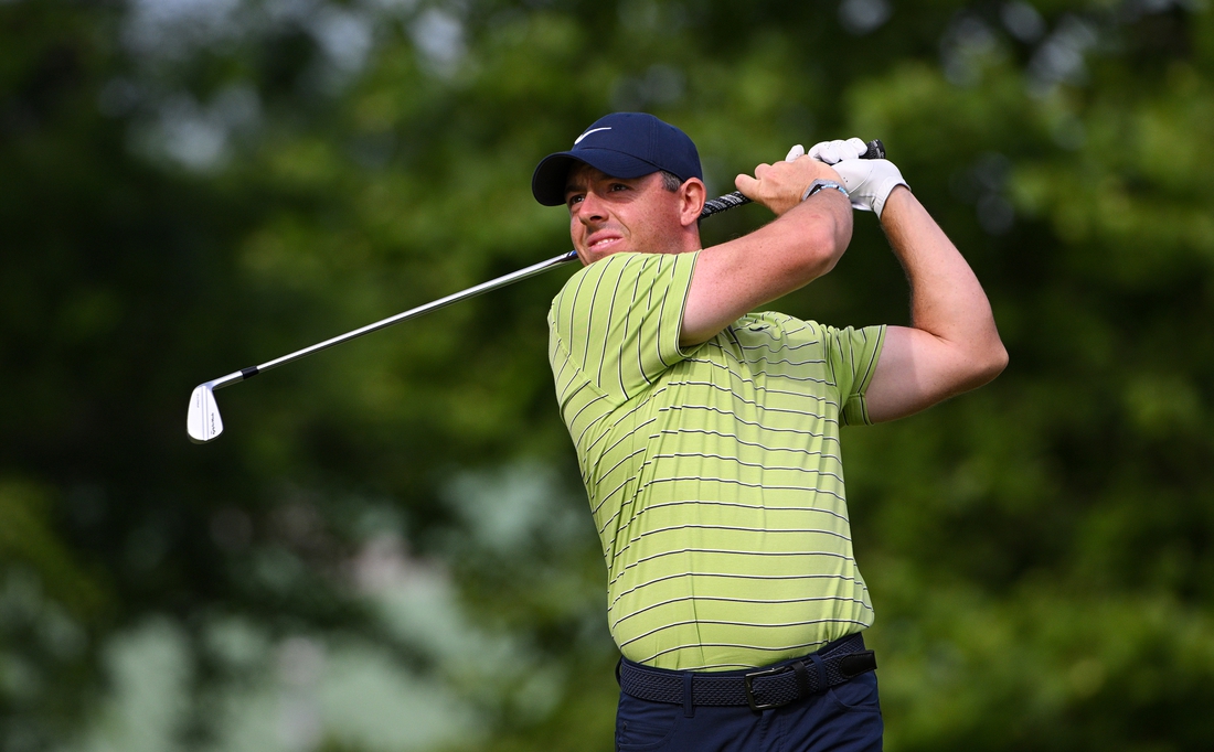 May 19, 2022; Tulsa, Oklahoma, USA; Rory McIlroy plays his shot on to the 14th tee during the first round of the PGA Championship golf tournament. Mandatory Credit: Orlando Ramirez-USA TODAY Sports