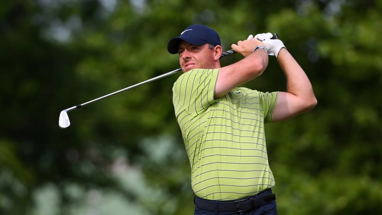 May 19, 2022; Tulsa, Oklahoma, USA; Rory McIlroy plays his shot on to the 14th tee during the first round of the PGA Championship golf tournament. Mandatory Credit: Orlando Ramirez-USA TODAY Sports