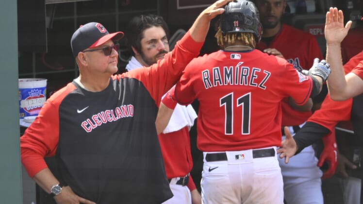May 19, 2022; Cleveland, Ohio, USA; Cleveland Guardians third baseman Jose Ramirez (11) celebrates his RBI single with manager Terry Francona (77) in the eighth inning against the Cincinnati Reds at Progressive Field. Mandatory Credit: David Richard-USA TODAY Sports