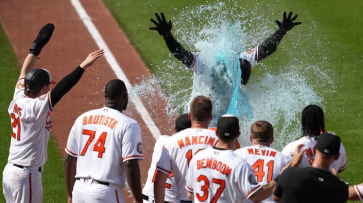 May 19, 2022; Baltimore, Maryland, USA; Baltimore Orioles outfielder Anthony Santander (25) showered by teammates following his game winning home run in the ninth inning against the New York Yankees at Oriole Park at Camden Yards. Mandatory Credit: Mitch Stringer-USA TODAY Sports