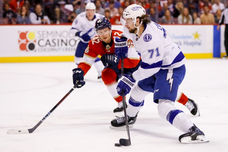 May 19, 2022; Sunrise, Florida, USA; Tampa Bay Lightning center Anthony Cirelli (71) moves the puck ahead of Florida Panthers defenseman Gustav Forsling (42) during the first period in game two of the second round of the 2022 Stanley Cup Playoffs at FLA Live Arena. Mandatory Credit: Sam Navarro-USA TODAY Sports
