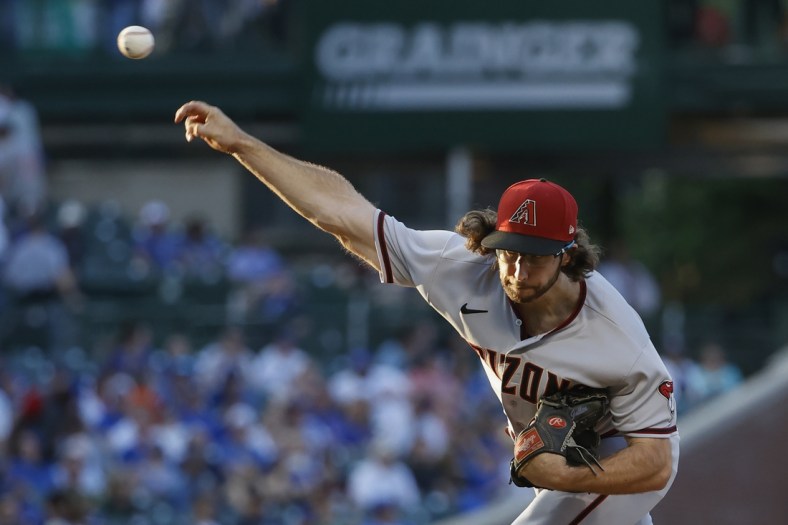 May 19, 2022; Chicago, Illinois, USA; Arizona Diamondbacks starting pitcher Zac Gallen (23) delivers against the Chicago Cubs during the third inning at Wrigley Field. Mandatory Credit: Kamil Krzaczynski-USA TODAY Sports
