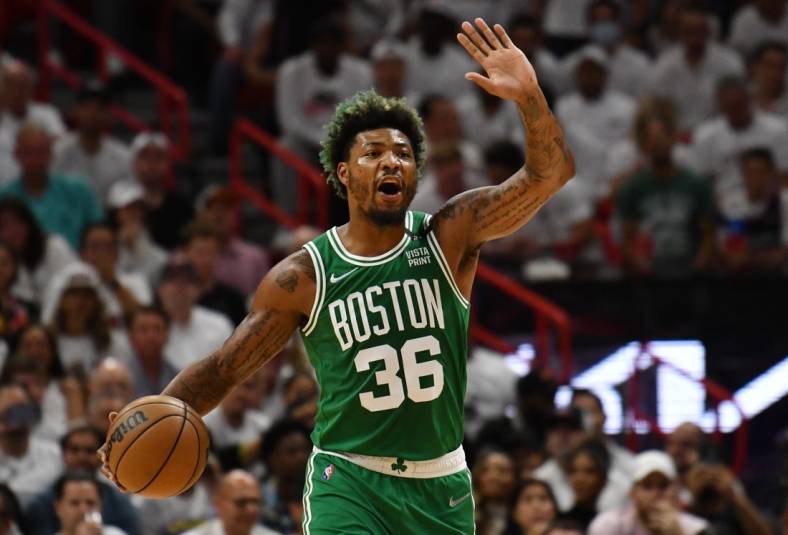 May 19, 2022; Miami, Florida, USA; Boston Celtics guard Marcus Smart (36) brings the ball up court during the first half against the Miami Heat in game two of the 2022 eastern conference finals at FTX Arena. Mandatory Credit: Jim Rassol-USA TODAY Sports