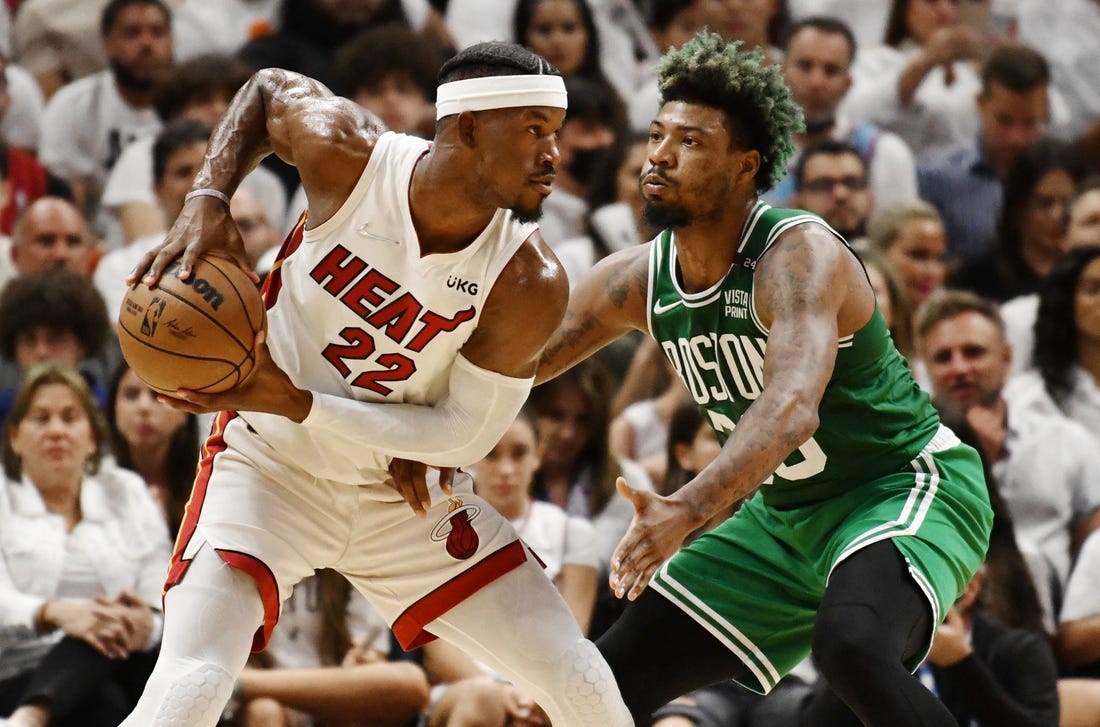 May 19, 2022; Miami, Florida, USA; Boston Celtics guard Marcus Smart (36) defends Miami Heat forward Jimmy Butler (22) during the first half of game two of the 2022 eastern conference finals at FTX Arena. Mandatory Credit: Jim Rassol-USA TODAY Sports