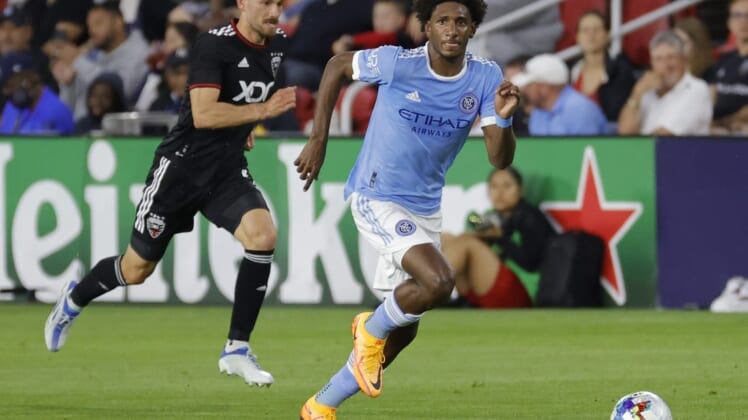 May 18, 2022; Washington, District of Columbia, USA; New York City FC forward Talles Magno (43) dribbles the ball as D.C. United defender Brendan Hines-Ike (4) chases at Audi Field. Mandatory Credit: Geoff Burke-USA TODAY Sports