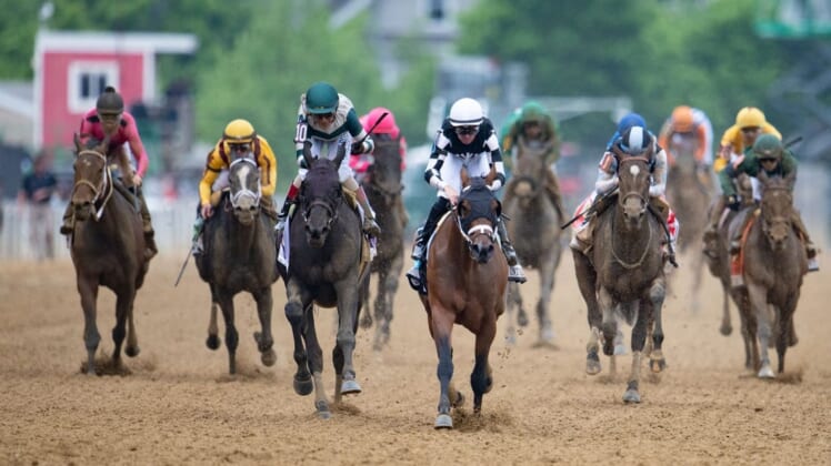 May 20, 2022; Baltimore, MD, USA; Florent Group aboard Interstatedaydream (back and white) wins the running of the Black-Eyed Susan Day at Pimlico Race Course. Mandatory Credit: Tommy Gilligan-USA TODAY Sports