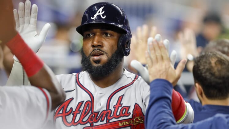 May 20, 2022; Miami, Florida, USA; Atlanta Braves left fielder Marcell Ozuna (20) celebrates with teammates after hitting a home run during the first inning against the Miami Marlins at loanDepot Park. Mandatory Credit: Sam Navarro-USA TODAY Sports