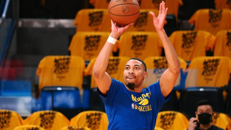 May 20, 2022; San Francisco, California, USA; Golden State Warriors forward Otto Porter Jr. (32) warms up before game two of the 2022 western conference finals against the Dallas Mavericks at Chase Center. Mandatory Credit: Kelley L Cox-USA TODAY Sports