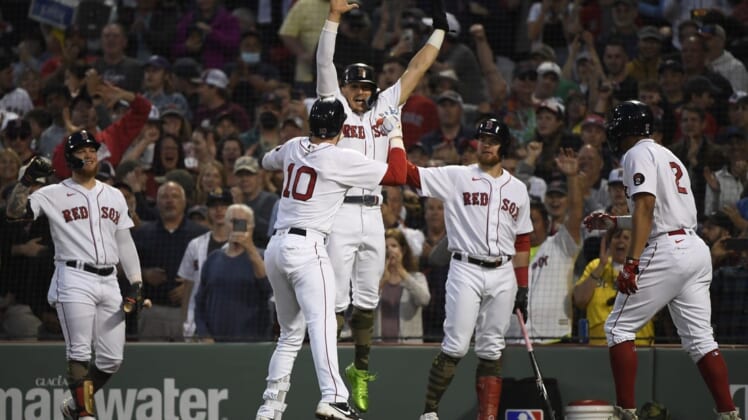 May 20, 2022; Boston, Massachusetts, USA;  Boston Red Sox center fielder Kike Hernandez (5) reacts with second baseman Trevor Story (10) after Story hit a grand slam during the third inning against the Seattle Mariners at Fenway Park. Mandatory Credit: Bob DeChiara-USA TODAY Sports