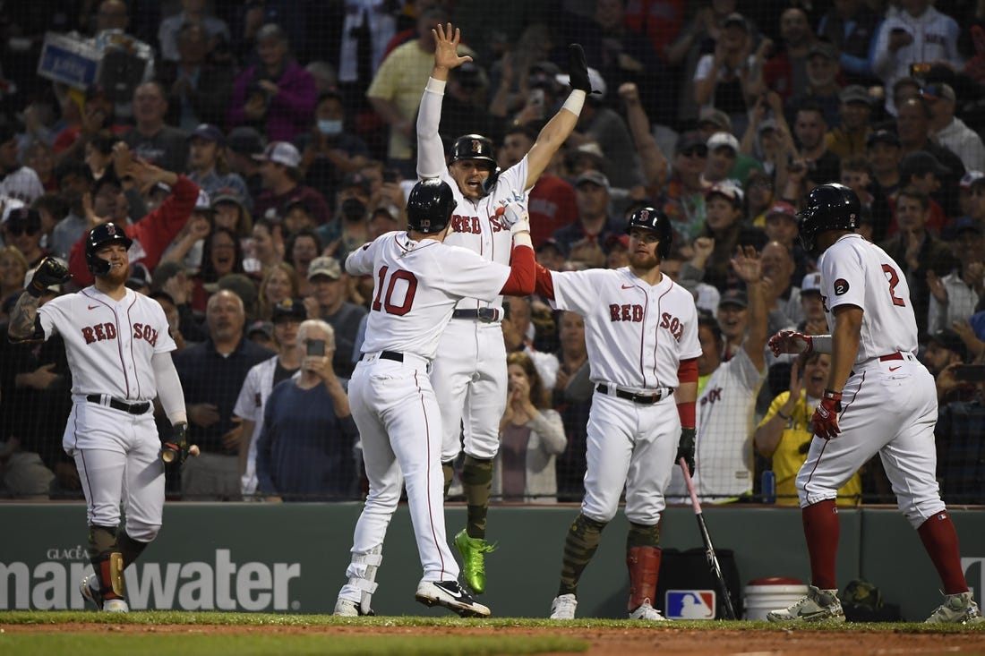 May 20, 2022; Boston, Massachusetts, USA;  Boston Red Sox center fielder Kike Hernandez (5) reacts with second baseman Trevor Story (10) after Story hit a grand slam during the third inning against the Seattle Mariners at Fenway Park. Mandatory Credit: Bob DeChiara-USA TODAY Sports