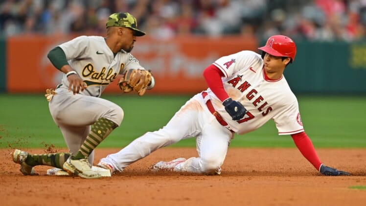 May 20, 2022; Anaheim, California, USA;  Los Angeles Angels designated hitter Shohei Ohtani (17) beats the tag by Oakland Athletics second baseman Tony Kemp (5) for a stolen base in the first inning of the game at Angel Stadium. Mandatory Credit: Jayne Kamin-Oncea-USA TODAY Sports