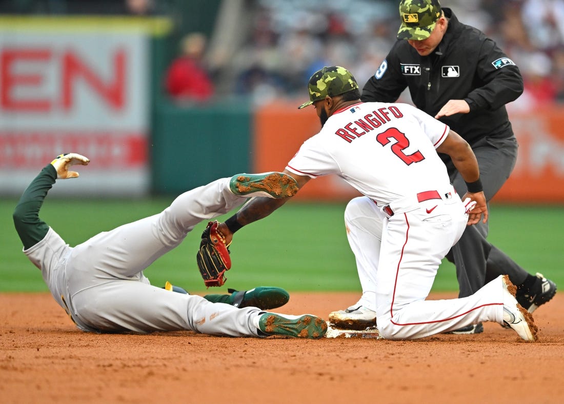 May 20, 2022; Anaheim, California, USA;  Oakland Athletics center fielder Ramon Laureano (22) makes it back safe to second on a pick off attempt to Los Angeles Angels second baseman Luis Rengifo (2) in the second inning at Angel Stadium. Mandatory Credit: Jayne Kamin-Oncea-USA TODAY Sports