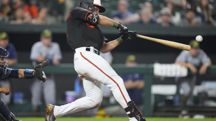 May 20, 2022; Baltimore, Maryland, USA; Baltimore Orioles right fielder Anthony Santander (25) hits an RBI single during the tenth inning against the Tampa Bay Rays at Oriole Park at Camden Yards. Mandatory Credit: Gregory Fisher-USA TODAY Sports