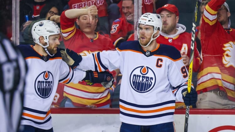 May 20, 2022; Calgary, Alberta, CAN; Edmonton Oilers center Connor McDavid (97) celebrates his goal with Edmonton Oilers center Leon Draisaitl (29) during the second period against the Calgary Flames in game two of the second round of the 2022 Stanley Cup Playoffs at Scotiabank Saddledome. Mandatory Credit: Sergei Belski-USA TODAY Sports