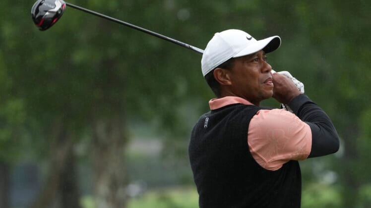 May 21, 2022; Tulsa, OK, USA; Tiger Woods plays his shot from the ninth tee as rain falls during the third round of the PGA Championship golf tournament at Southern Hills Country Club. Mandatory Credit: Michael Madrid-USA TODAY Sports