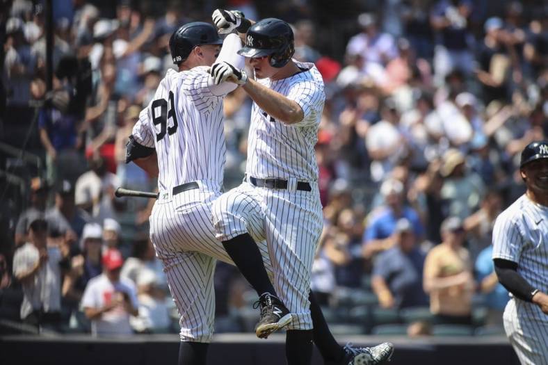 May 21, 2022; Bronx, New York, USA;  New York Yankees second baseman DJ LeMahieu (26) celebrates with center fielder Aaron Judge (99) after hitting a grand slam home run in the second inning against the Chicago White Sox at Yankee Stadium. Mandatory Credit: Wendell Cruz-USA TODAY Sports