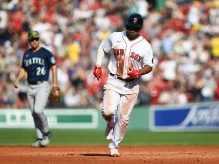 May 21, 2022; Boston, Massachusetts, USA;  Boston Red Sox third baseman Rafael Devers (11) runs the bases after hitting a solo home run against the Seattle Mariners during the third inning at Fenway Park. Mandatory Credit: Brian Fluharty-USA TODAY Sports