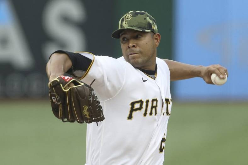 May 21, 2022; Pittsburgh, Pennsylvania, USA;  Pittsburgh Pirates starting pitcher Jose Quintana (62) delivers a pitch against the St. Louis Cardinals during the first inning at PNC Park. Mandatory Credit: Charles LeClaire-USA TODAY Sports