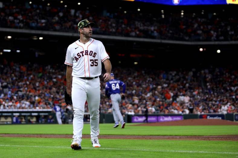 May 21, 2022; Houston, Texas, USA; Houston Astros starting pitcher Justin Verlander (35) walks to the dugout after retiring the side against the Texas Rangers during the third inning at Minute Maid Park. Mandatory Credit: Erik Williams-USA TODAY Sports