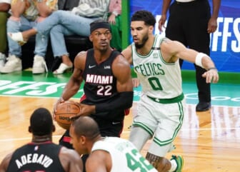 May 21, 2022; Boston, Massachusetts, USA; Miami Heat forward Jimmy Butler (22) drives the ball against Boston Celtics forward Jayson Tatum (0) in the first quarter during game three of the 2022 eastern conference finals at TD Garden. Mandatory Credit: David Butler II-USA TODAY Sports