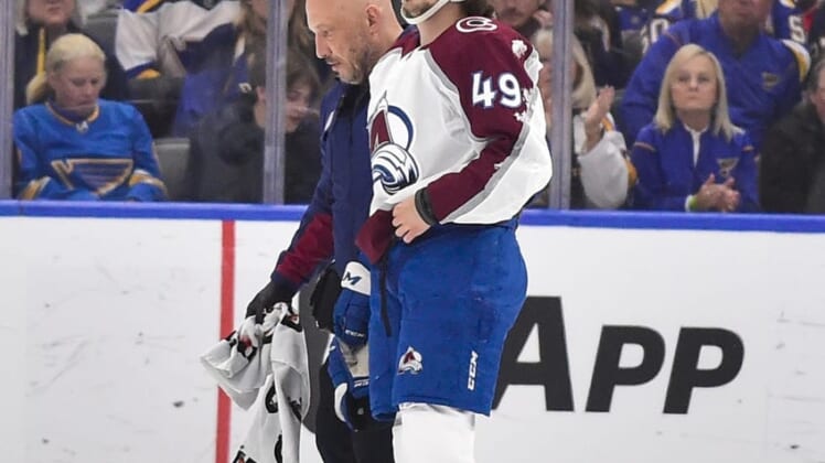 May 21, 2022; St. Louis, Missouri, USA; Colorado Avalanche defenseman Samuel Girard (49) is helped off the ice by a trainer after a hit by the St. Louis Blues during the first period in game three of the second round of the 2022 Stanley Cup Playoffs at Enterprise Center. Mandatory Credit: Jeff Curry-USA TODAY Sports