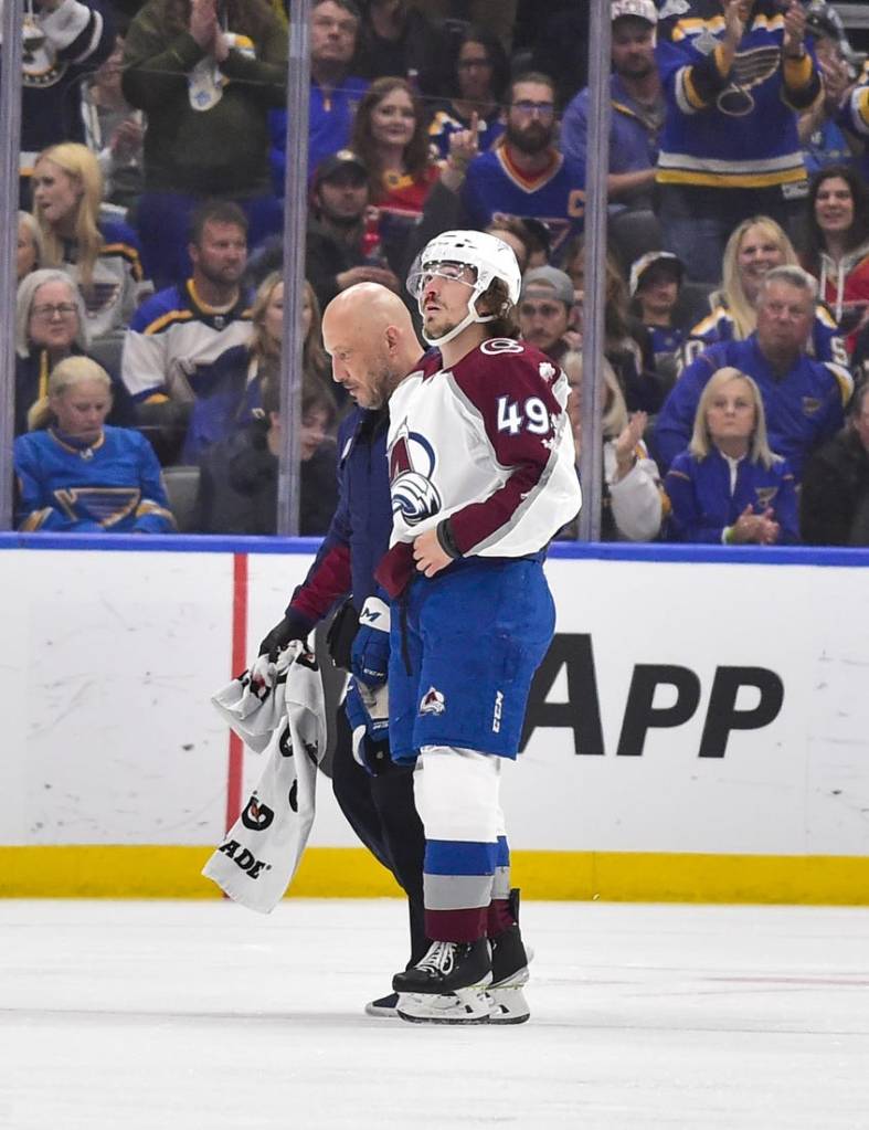 May 21, 2022; St. Louis, Missouri, USA; Colorado Avalanche defenseman Samuel Girard (49) is helped off the ice by a trainer after a hit by the St. Louis Blues during the first period in game three of the second round of the 2022 Stanley Cup Playoffs at Enterprise Center. Mandatory Credit: Jeff Curry-USA TODAY Sports