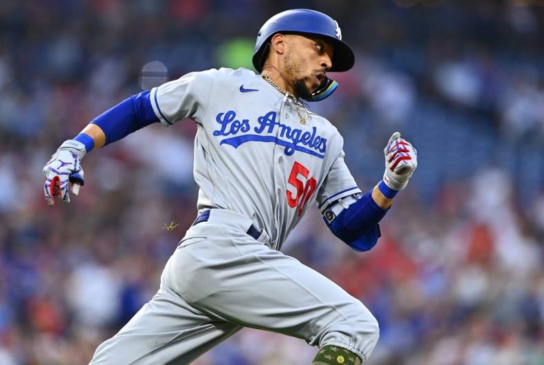 May 21, 2022; Philadelphia, Pennsylvania, USA; Los Angeles Dodgers outfielder Mookie Betts (50) rounds first base after hitting a RBI double against the Philadelphia Phillies in the fifth inning at Citizens Bank Park. Mandatory Credit: Kyle Ross-USA TODAY Sports