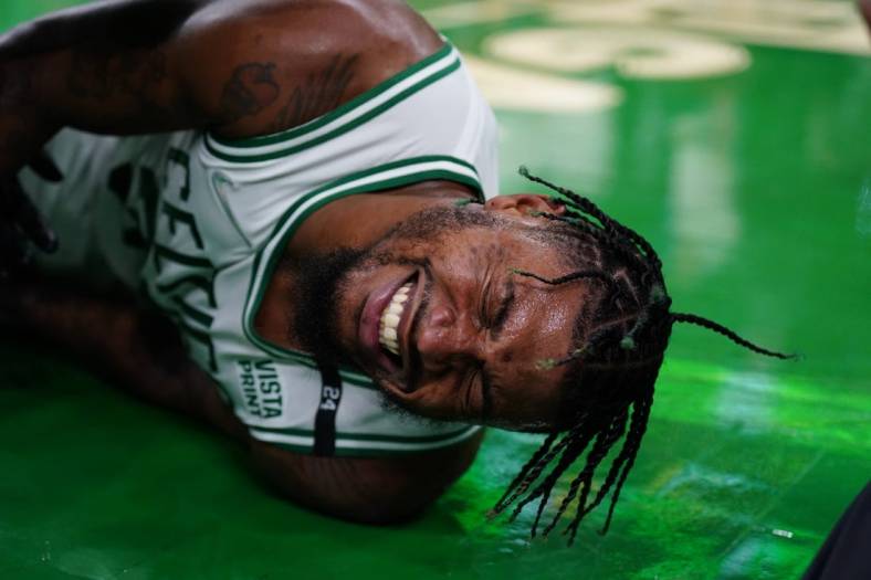 May 21, 2022; Boston, Massachusetts, USA; Boston Celtics guard Marcus Smart (36) reacts after suffering an apparent injury to his ankle against the Miami Heat n the third quarter during game three of the 2022 eastern conference finals at TD Garden. Mandatory Credit: David Butler II-USA TODAY Sports