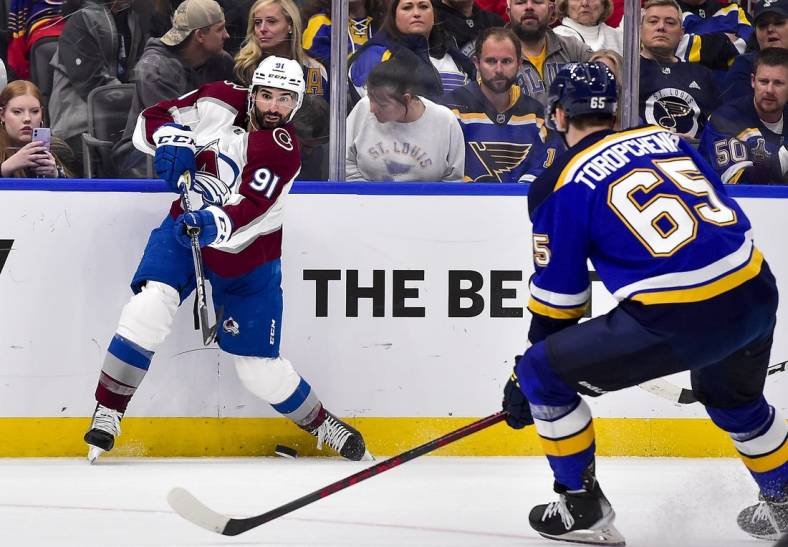 May 21, 2022; St. Louis, Missouri, USA; Colorado Avalanche center Nazem Kadri (91) shoots against the St. Louis Blues during the third period in game three of the second round of the 2022 Stanley Cup Playoffs at Enterprise Center. Mandatory Credit: Jeff Curry-USA TODAY Sports