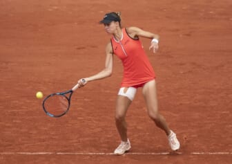 May 22, 2022; Paris, France;  Magda Linette (POL) returns the ball during her match against Ons Jabeur (TUN) on day one of the French Open at Stade Roland-Garros. Mandatory Credit: Susan Mullane-USA TODAY Sports