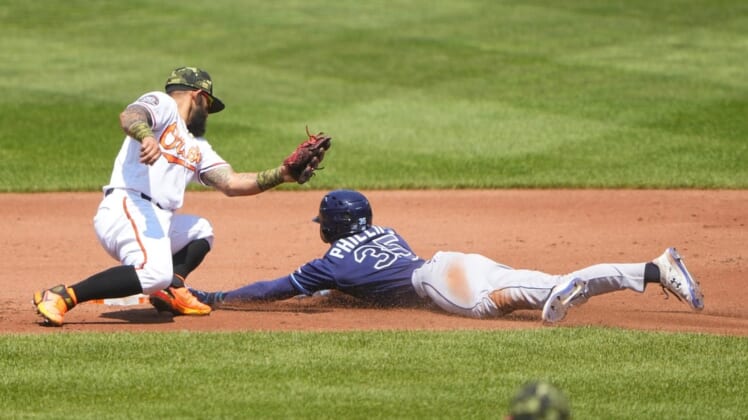 May 22, 2022; Baltimore, Maryland, USA; Tampa Bay Rays right fielder Brett Phillips (35) steals second base ahead of the tag by Baltimore Orioles second baseman Rougned Odor (12) during the first inning  at Oriole Park at Camden Yards. Mandatory Credit: Gregory Fisher-USA TODAY Sports