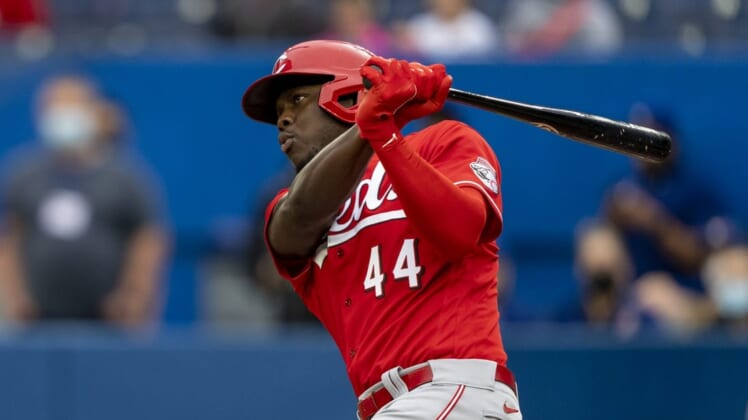 May 22, 2022; Toronto, Ontario, CAN;  Cincinnati Reds left fielder Aristides Aquino (44) hits a double during the first inning against the Toronto Blue Jays at Rogers Centre. Mandatory Credit: Kevin Sousa-USA TODAY Sports