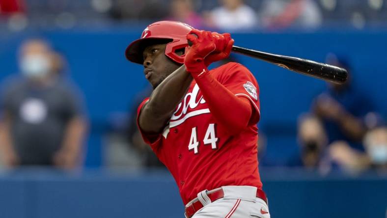 May 22, 2022; Toronto, Ontario, CAN;  Cincinnati Reds left fielder Aristides Aquino (44) hits a double during the first inning against the Toronto Blue Jays at Rogers Centre. Mandatory Credit: Kevin Sousa-USA TODAY Sports