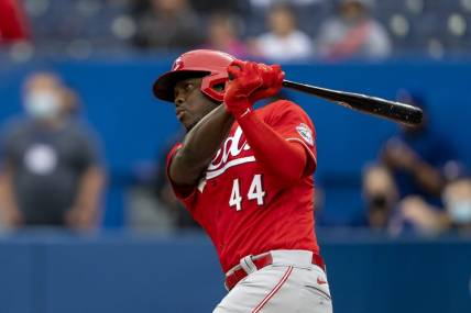 May 22, 2022; Toronto, Ontario, CAN;  Cincinnati Reds left fielder Aristides Aquino (44) hits a double during the first inning against the Toronto Blue Jays at Rogers Centre. Mandatory Credit: Kevin Sousa-USA TODAY Sports