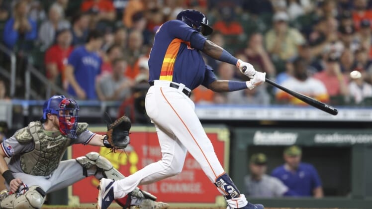 May 22, 2022; Houston, Texas, USA;  Houston Astros left fielder Yordan Alvarez (44) hits a RBI double against the Texas Rangers in the fifth inning at Minute Maid Park. Mandatory Credit: Thomas Shea-USA TODAY Sports
