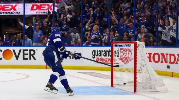 May 22, 2022; Tampa, Florida, USA; Tampa Bay Lightning right wing Nikita Kucherov (86) shoots into an empty net for a goal against the Florida Panthers in the third period in game three of the second round of the 2022 Stanley Cup Playoffs at Amalie Arena. Mandatory Credit: Nathan Ray Seebeck-USA TODAY Sports