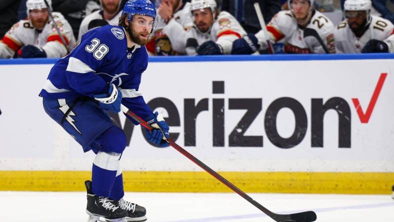 May 22, 2022; Tampa, Florida, USA; Tampa Bay Lightning left wing Brandon Hagel (38) looks to pass the puck in the third period against the Florida Panthers in game three of the second round of the 2022 Stanley Cup Playoffs at Amalie Arena. Mandatory Credit: Nathan Ray Seebeck-USA TODAY Sports