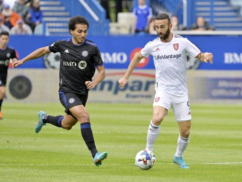 May 22, 2022; Montreal, Quebec, CAN;  Real Salt Lake forward Justin Meram (9) plays the ball and CF Montreal midfielder Ahmed Hamdi (7) defends during the first half at Stade Saputo. Mandatory Credit: Eric Bolte-USA TODAY Sports