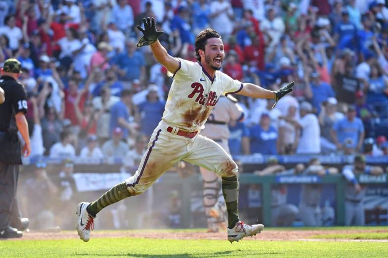 May 22, 2022; Philadelphia, Pennsylvania, USA; Philadelphia Phillies catcher Garrett Stubbs (21) reacts after scoring a run as they defeated the Los Angeles Dodgers during the tenth inning at Citizens Bank Park. Mandatory Credit: Eric Hartline-USA TODAY Sports