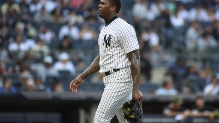 May 22, 2022; Bronx, New York, USA;  New York Yankees relief pitcher Aroldis Chapman (54) walks off the mound in the ninth inning after blowing a save against the Chicago White Sox at Yankee Stadium. Mandatory Credit: Wendell Cruz-USA TODAY Sports