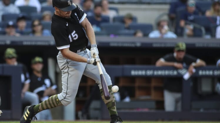 May 22, 2022; Bronx, New York, USA;  Chicago White Sox right fielder Adam Engel (15) hits an RBI double in the ninth inning against the New York Yankees at Yankee Stadium. Mandatory Credit: Wendell Cruz-USA TODAY Sports