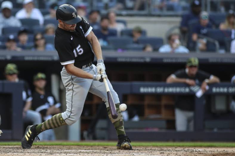 May 22, 2022; Bronx, New York, USA;  Chicago White Sox right fielder Adam Engel (15) hits an RBI double in the ninth inning against the New York Yankees at Yankee Stadium. Mandatory Credit: Wendell Cruz-USA TODAY Sports