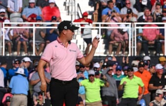 May 22, 2022; Tulsa, OK, USA; Justin Thomas acknowledges the crowd after a putt on the 17th green during the final round of the PGA Championship golf tournament at Southern Hills Country Club. Mandatory Credit: Orlando Ramirez-USA TODAY Sports