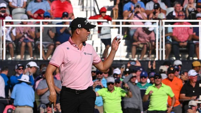 May 22, 2022; Tulsa, OK, USA; Justin Thomas acknowledges the crowd after a putt on the 17th green during the final round of the PGA Championship golf tournament at Southern Hills Country Club. Mandatory Credit: Orlando Ramirez-USA TODAY Sports